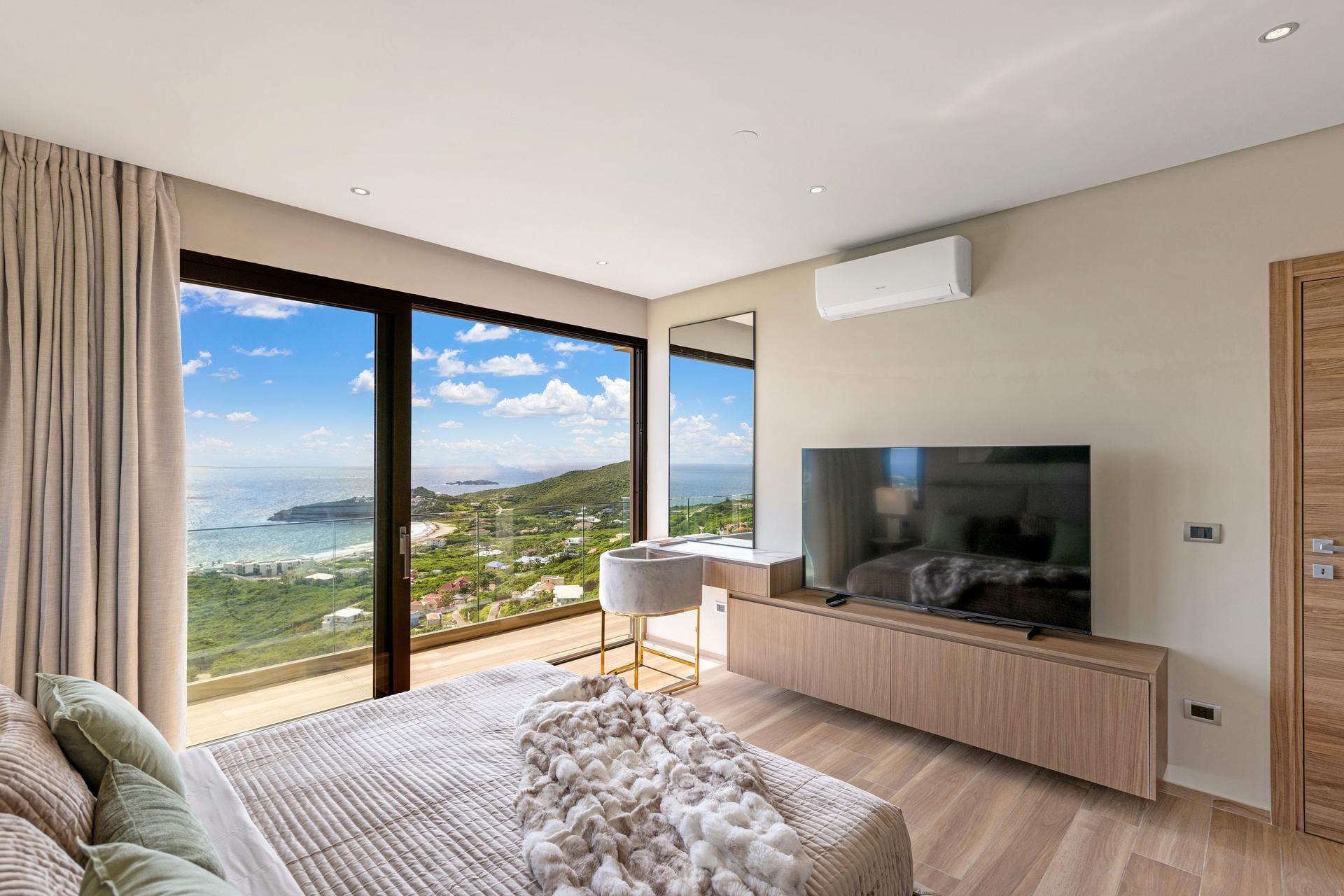 Contemporary Ocean‑View Apartment with Marble‑Veined Waterfall Island & Panoramic Glass Terrace